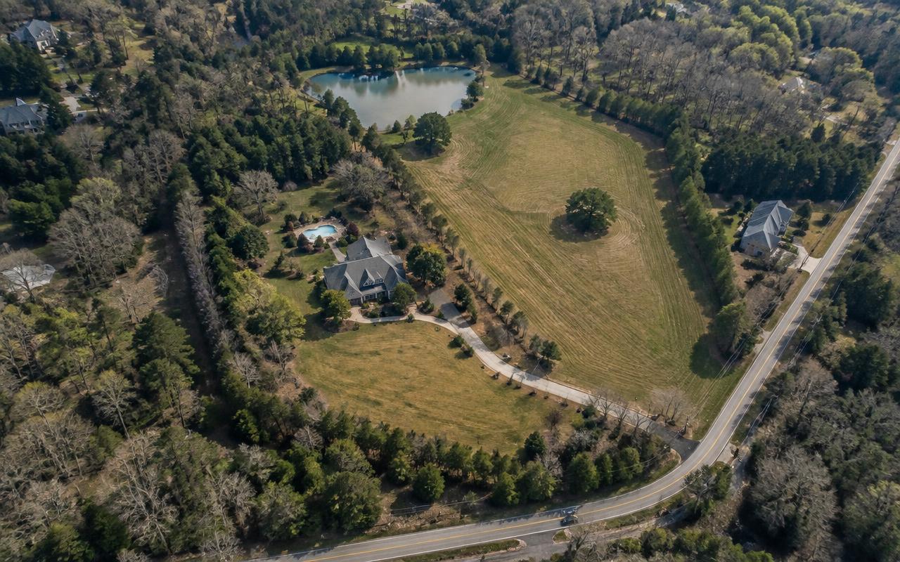 A large residential property along a quiet road in Weddington